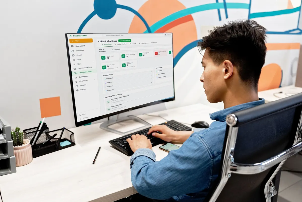 A staffer at his desk working in the FundraiserMax Calls & Meetings screen
